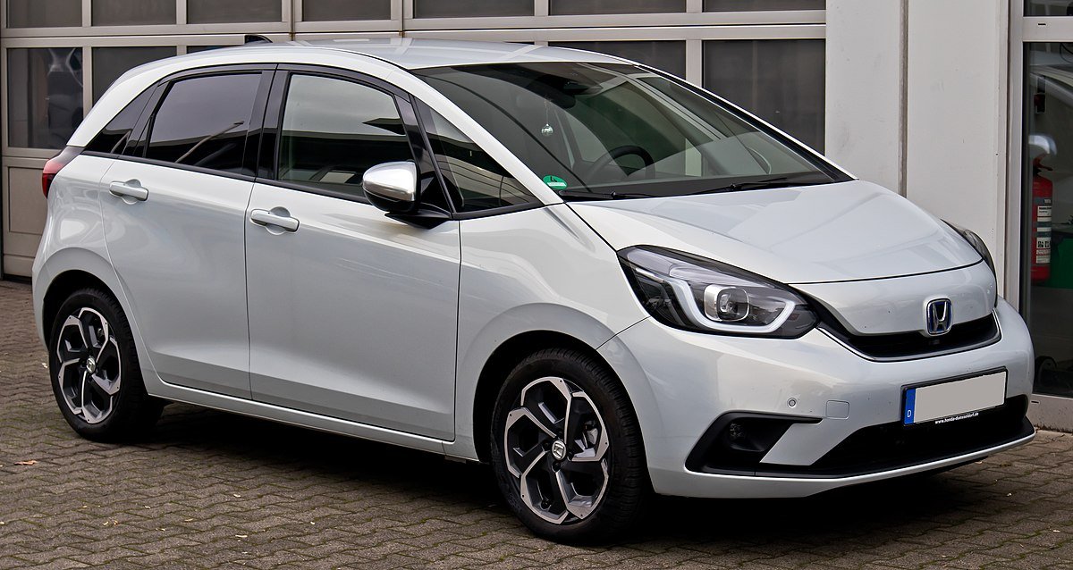 Honda Jazz Complete Review 2025: Premium Hatchback Value Guide For Indian Buyers Here is the improved version without any hyperlinks, with a catchy H1, and with more relevant keywords naturally added for SEO such as Honda Jazz review, premium hatchback India, Honda Jazz mileage, Honda Jazz features, Honda Jazz engine, Honda Jazz interior, Honda Jazz performance, and Honda Jazz price. Introduction The Honda Jazz has been a strong name in the premium hatchback segment in India. Even though it is no longer on sale as a new model, it continues to attract buyers in the used car market. People choose it for the spacious interior, reliable Honda engine, comfortable ride quality and practical design. The Jazz always offered more space than regular hatchbacks which made it popular among families and daily commuters. This detailed Honda Jazz review for 2025 explains its interior, features, performance, mileage, comfort and overall value for Indian buyers. The language is simple, the sentences are short, and the article focuses on clarity. Why Honda Jazz Still Stands Strong Honda Jazz continues to be relevant because it offers something that many hatchbacks fail to provide. It gives a roomy cabin that feels like a small sedan. It is easy to drive in busy cities. It has a smooth engine. It has strong long term reliability. The maintenance cost is also under control for most owners. Buyers looking for a premium hatchback that blends comfort and practicality still consider the Jazz. Families like the rear seat space. Young professionals like the premium look and smooth performance. City drivers enjoy the light steering and good visibility. All of these points keep the Jazz desirable in the Indian market. Latest Specifications and Mechanical Details Engine and Power The last Indian model of Honda Jazz had a 1.2 litre i VTEC petrol engine. It produced close to 90 PS of power and around 110 Nm of torque. This engine is known for refinement and smooth driving. It does not feel noisy. It does not vibrate much. It is ideal for long term use. Transmission The car came with a 5 speed manual gearbox. It also had a CVT automatic option. The CVT worked very well in traffic and gave a relaxed driving feel. Many buyers preferred it for daily city use. Mileage The Honda Jazz mileage was one of its strong points. The manual variant returned mileage figures in the range of mid 16 kmpl. The CVT version delivered close to 17 kmpl under normal conditions. Good mileage helped reduce daily running costs. Price Range When it was last sold in India, its price ranged from eight lakh to a little over ten lakh. The used car market still shows stable pricing because of strong demand and Honda reliability. Interior, Comfort and Space Cabin Layout The interior of Honda Jazz has always been its biggest attraction. The cabin feels open and airy. The headroom is very good. Rear seat legroom is better than many hatchbacks and even some compact sedans. The tall stance and large glass area add to the comfort experience. Seating The front seats offer good support for long drives. The rear seats can comfortably seat two adults and a child. For regular city drives, three adults can sit at the back without feeling squeezed. This comfort makes it a great option for families. Boot Space Boot space is impressive for a hatchback. It handles weekend luggage and grocery bags with ease. The wide opening makes loading simple. Features Higher variants of Jazz included premium features such as • Touchscreen infotainment • Automatic climate control • Steering mounted controls • Power adjustable ORVMs • Alloy wheels • Smart entry and push button start (in select variants) • Paddle shifters in the CVT model The features gave Jazz a premium feel compared to other hatchbacks in its price range. Driving Experience and Ride Quality City Driving Honda Jazz is one of the easiest premium hatchbacks to drive in city conditions. The steering is light. The visibility is great. The engine responds smoothly at low speeds. Parking in tight spaces feels simple because of the compact body size. Highway Performance On highways, the Jazz offers stable performance. It picks up speed gradually. It is not a very powerful car, but it feels confident and stable at cruising speeds. Long-distance rides feel comfortable thanks to the spacious cabin and well cushioned seats. Suspension and Comfort The suspension is tuned for comfort. It absorbs potholes and rough roads well. Indian road conditions often test suspension quality and Jazz handles this challenge smoothly. Areas Where Honda Jazz Could Improve The Jazz has many strengths but also some limitations. • Engine power is modest. People looking for high performance may feel it lacks excitement. • Some newer rivals offer more modern technology features. • After discontinuation, some trims may have slower availability of certain body parts in smaller towns. • The modern premium hatchback segment has grown stronger, so competition is higher today. Still, for reliability and comfort, Jazz remains tough to beat. Quick Specification Table Category Details Body Type Premium hatchback Engine 1.2 litre i VTEC petrol Power Around 90 PS Torque Around 110 Nm Gearbox 5 speed manual and CVT automatic Mileage Around 16.5 to 17 kmpl Seating Capacity 5 people Interior Space Very spacious for its segment Boot Space Large and practical Features Touchscreen, auto AC, steering controls, alloy wheels, paddle shifters (CVT) Ideal For Families, city users, daily commuters Frequently Asked Questions Is Honda Jazz still worth buying in 2025? Yes. If you want a reliable and spacious hatchback with good comfort and mileage, Jazz is still a smart choice. Is Honda Jazz good for long drives? Yes. The seats are comfortable and the cabin is roomy. It performs well on highways as long as you drive within its power limits. Does Honda Jazz give good mileage? Yes. It delivers around mid 16 to 17 kmpl depending on driving style and traffic. Is the CVT model good? It is very smooth and perfect for city traffic. Paddle shifters add extra control. Are spare parts available? Honda has good support in major cities. Regular service parts are widely available. Conclusion Honda Jazz remains one of the most comfortable and practical premium hatchbacks for Indian buyers even in 2025. It offers a smooth engine, excellent interior space, strong mileage and reliable long term performance. These qualities make it suitable for families, professionals and daily city commuters. Even though it is discontinued as a new model, the used car market continues to value it strongly. If you need a premium hatchback that focuses on comfort, practicality and dependable performance instead of aggressive power or flashy features, the Honda Jazz is a smart and sensible choice.